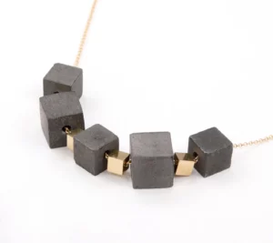 Gold cubes and black concrete